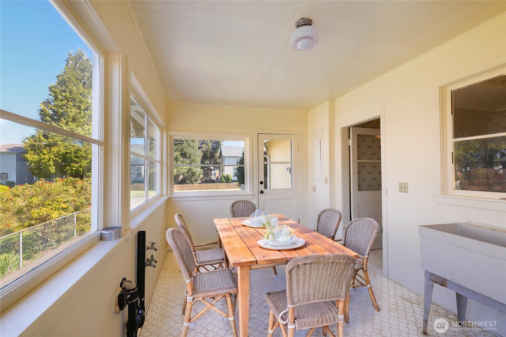 1320 4th Street Cosmopolis, WA 98537 - Photo 16 of 40 a view of a dining room with furniture large windows and wooden floor