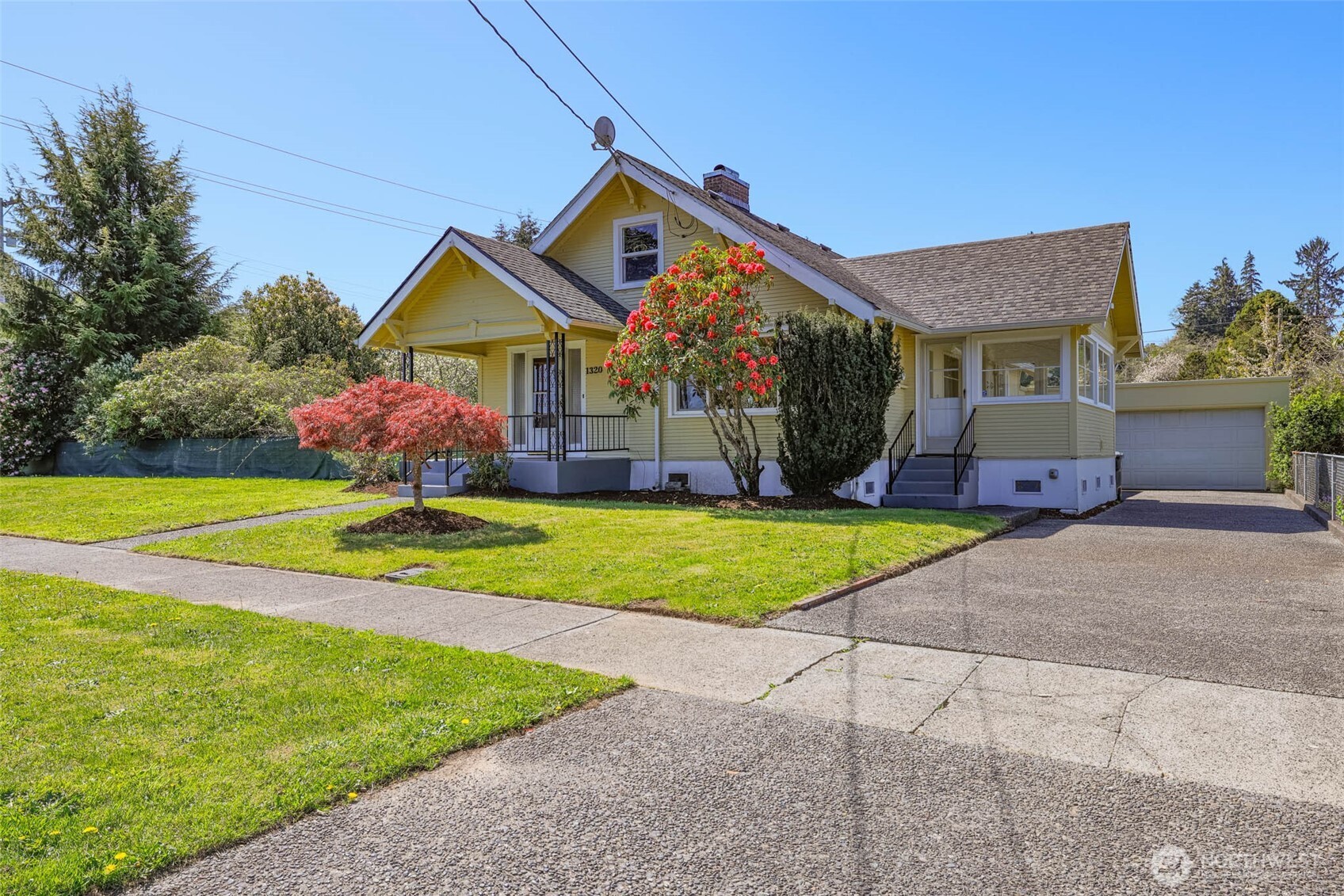 1320 4th Street Cosmopolis, WA 98537 - Photo 2 of 40 a front view of house with yard and green space