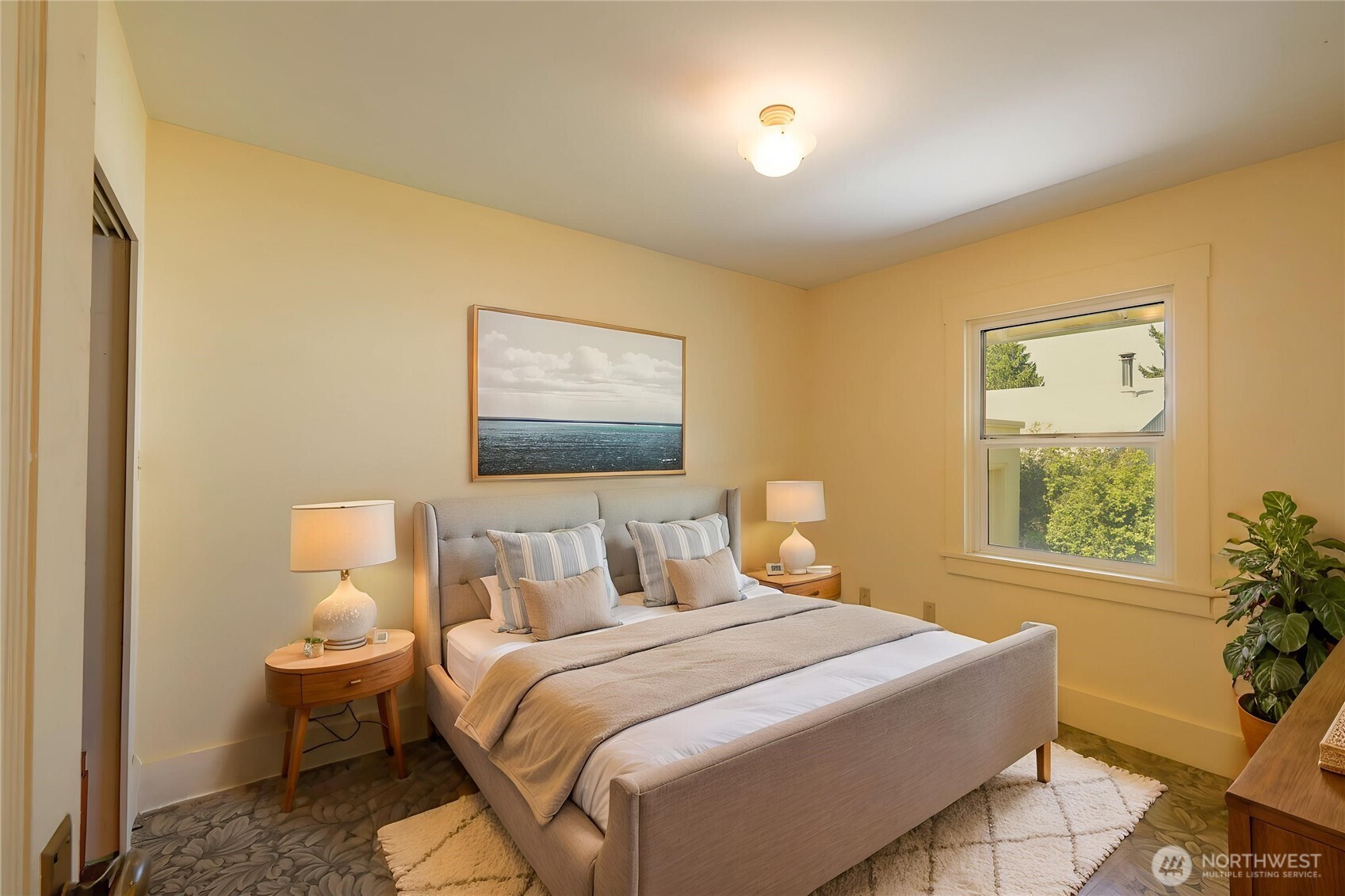 1320 4th Street Cosmopolis, WA 98537 - Photo 23 of 40 a bedroom with a bed and wooden floor