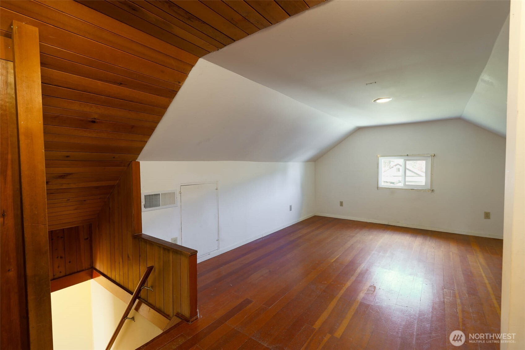 1320 4th Street Cosmopolis, WA 98537 - Photo 27 of 40 a view of an empty room with wooden floor and a window