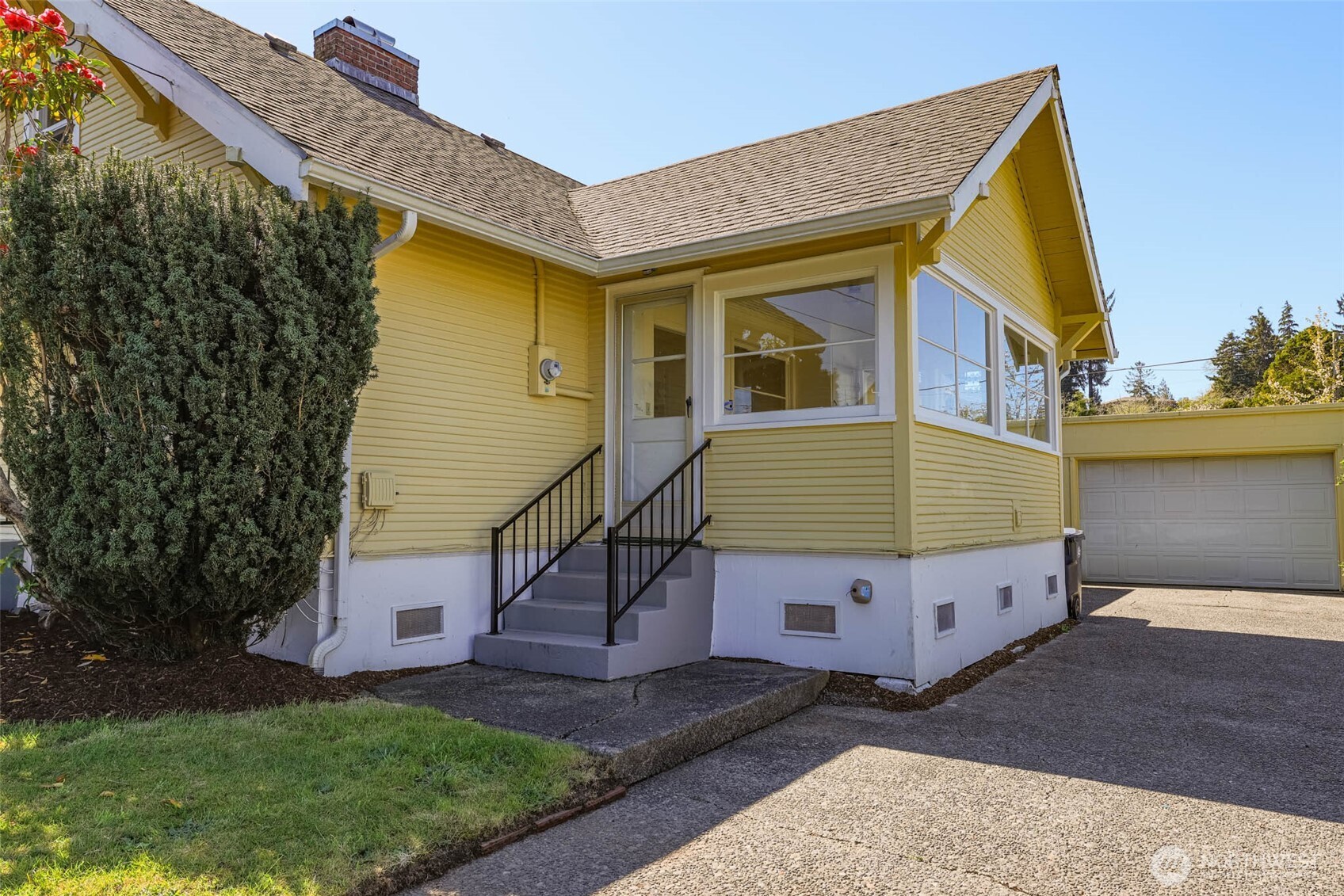 1320 4th Street Cosmopolis, WA 98537 - Photo 3 of 40 a front view of a house with garden