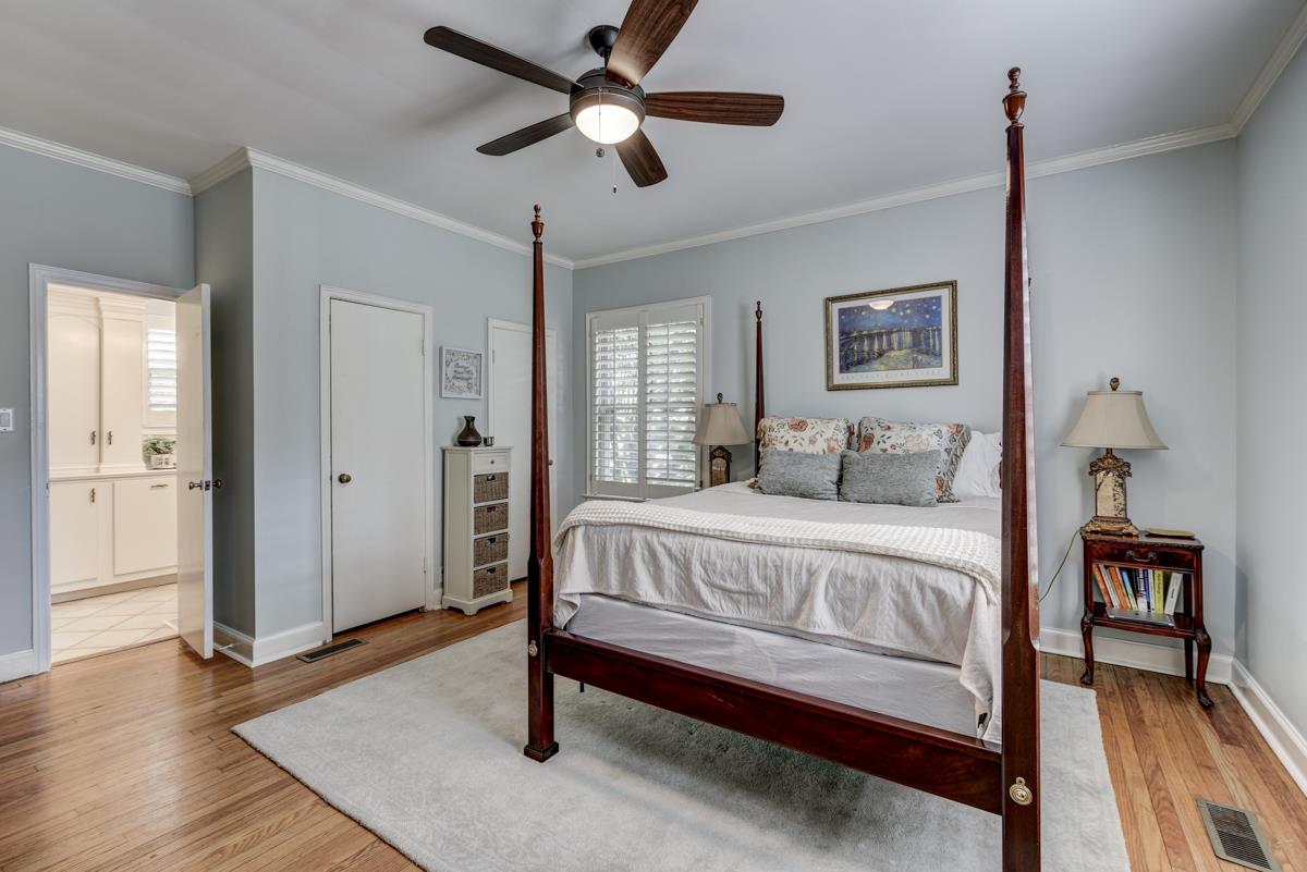 1132 Winding Way Road Nashville, TN 37216 - Photo 16 of 30 Master bedroom on main floor with lovely crown molding, baseboards, and a new ceiling fan.