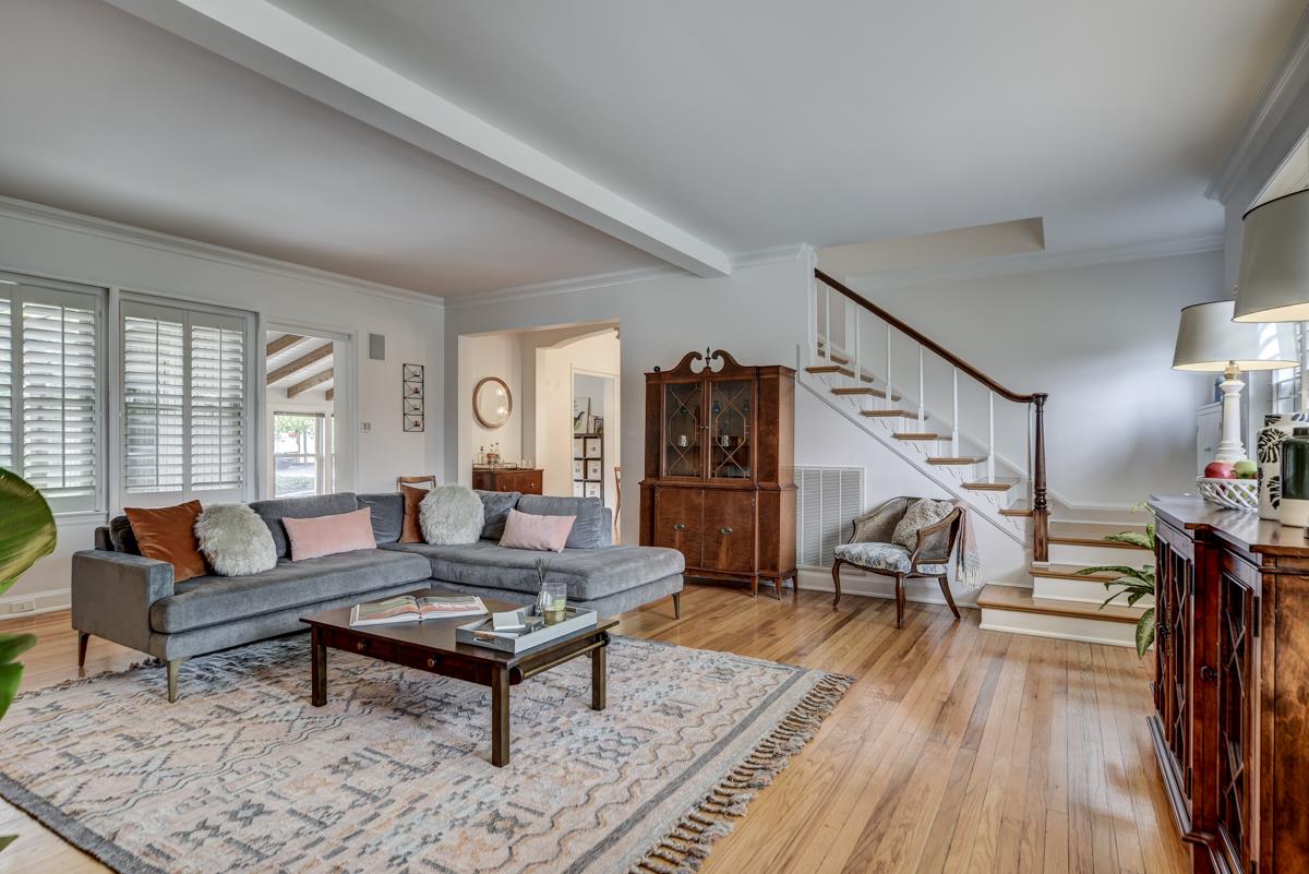 Spacious yet inviting living room looks onto the lovely front yard.