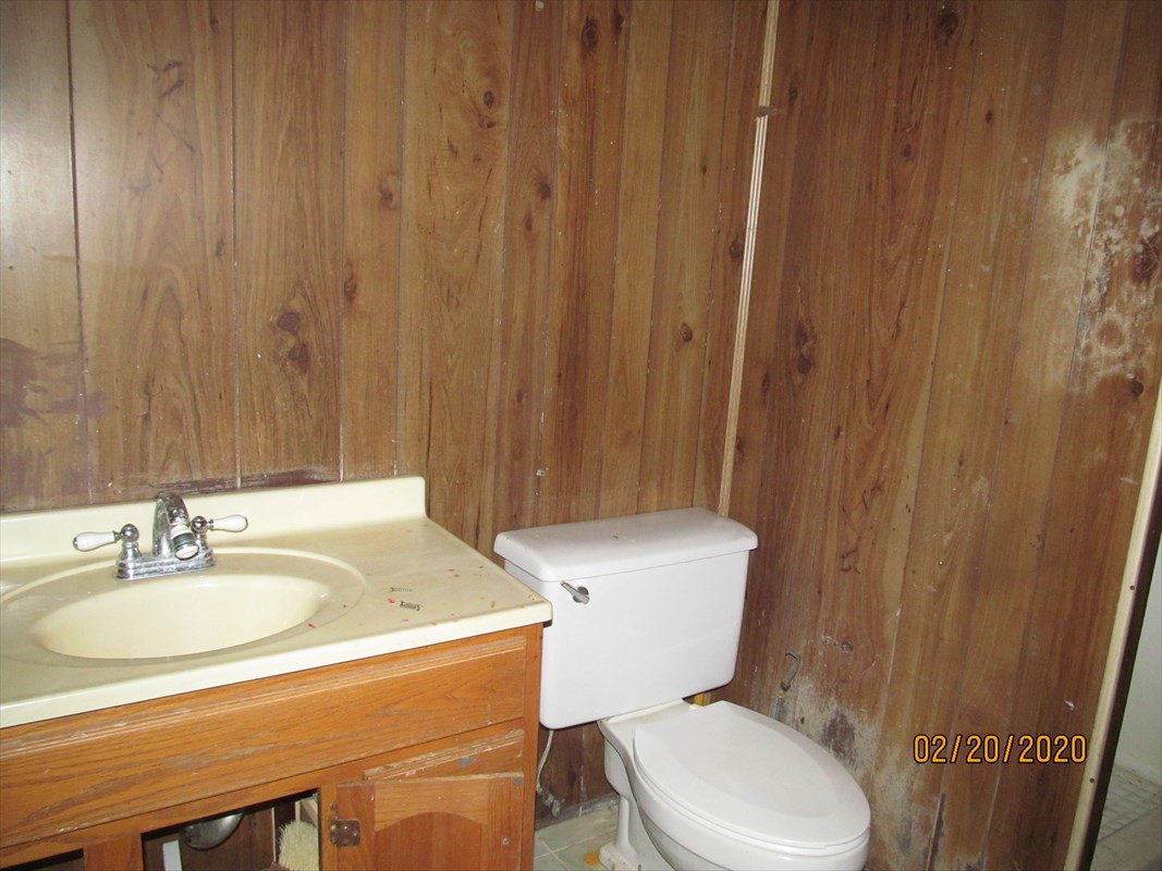 4912 Ohu Road Kapaa, HI 96746 - Photo 8 of 9 a bathroom with a sink a toilet and a mirror