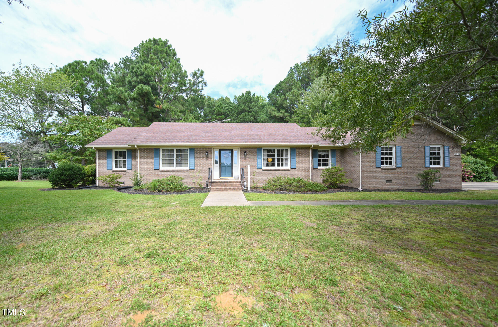 7254 Springfield School Road Lucama, NC 27851 - Photo 1 of 54 a front view of a house with a yard