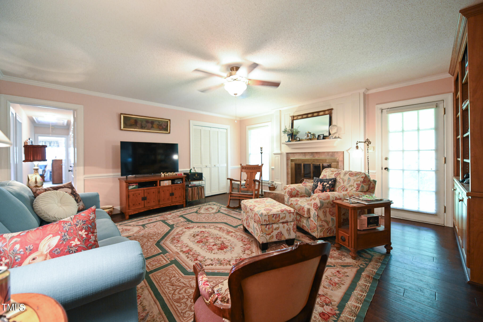 7254 Springfield School Road Lucama, NC 27851 - Photo 18 of 54 a living room with fireplace furniture flat screen tv and wooden floor