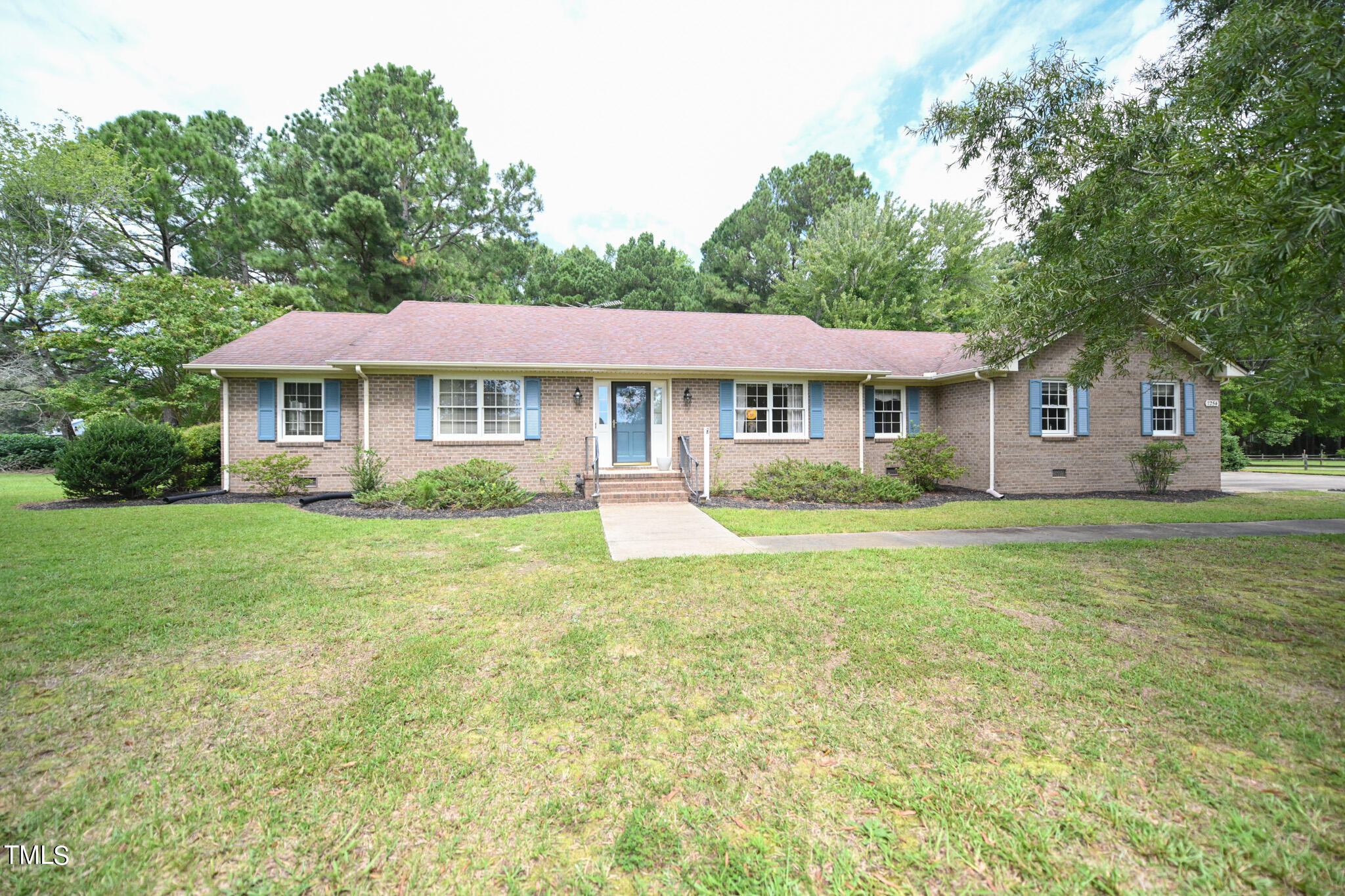 7254 Springfield School Road Lucama, NC 27851 - Photo 2 of 54 a front view of a house with a yard and trees
