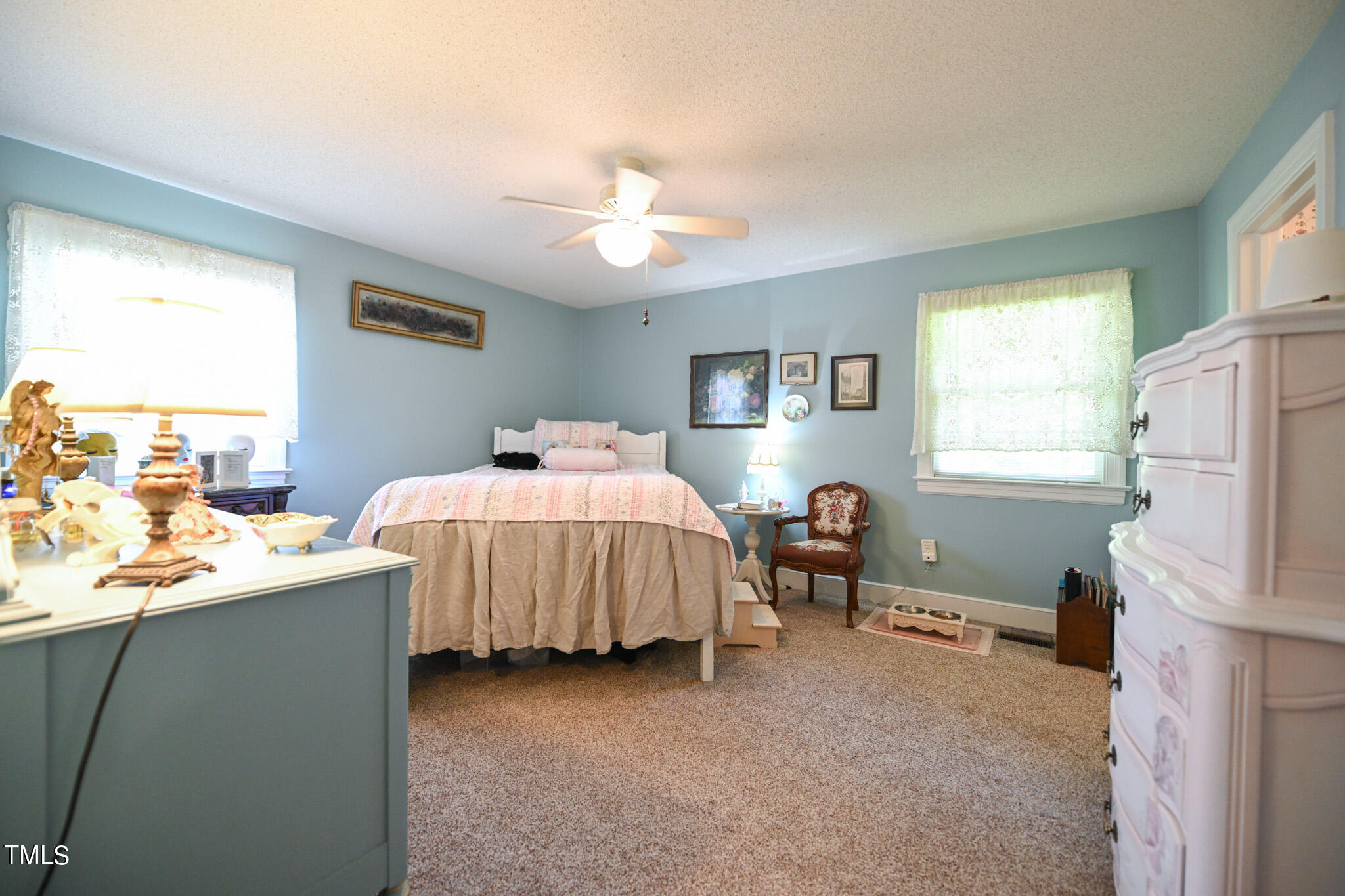 7254 Springfield School Road Lucama, NC 27851 - Photo 29 of 54 a bedroom with a bed and a table in it