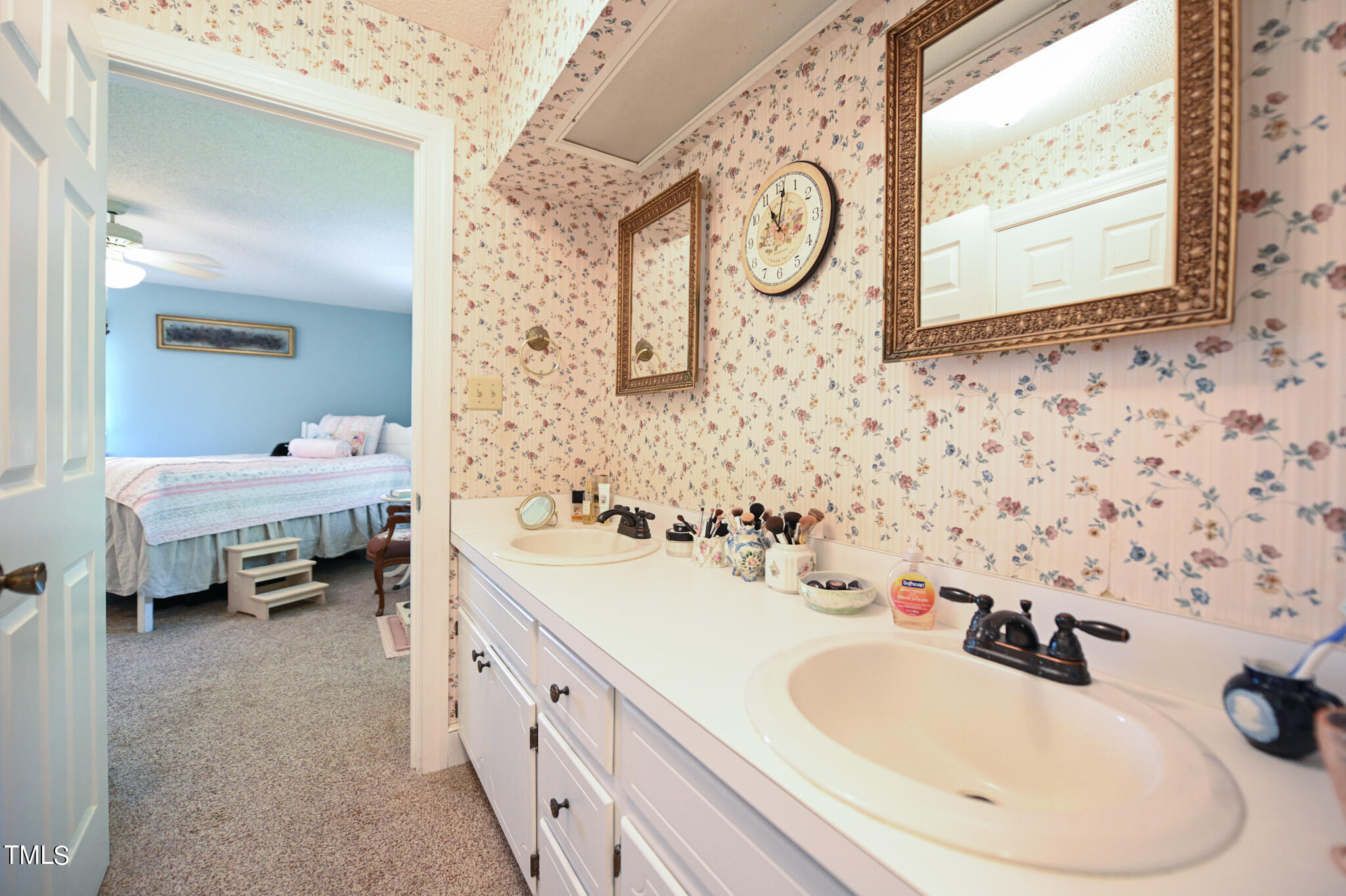 7254 Springfield School Road Lucama, NC 27851 - Photo 33 of 54 a bathroom with a double vanity sink mirror and