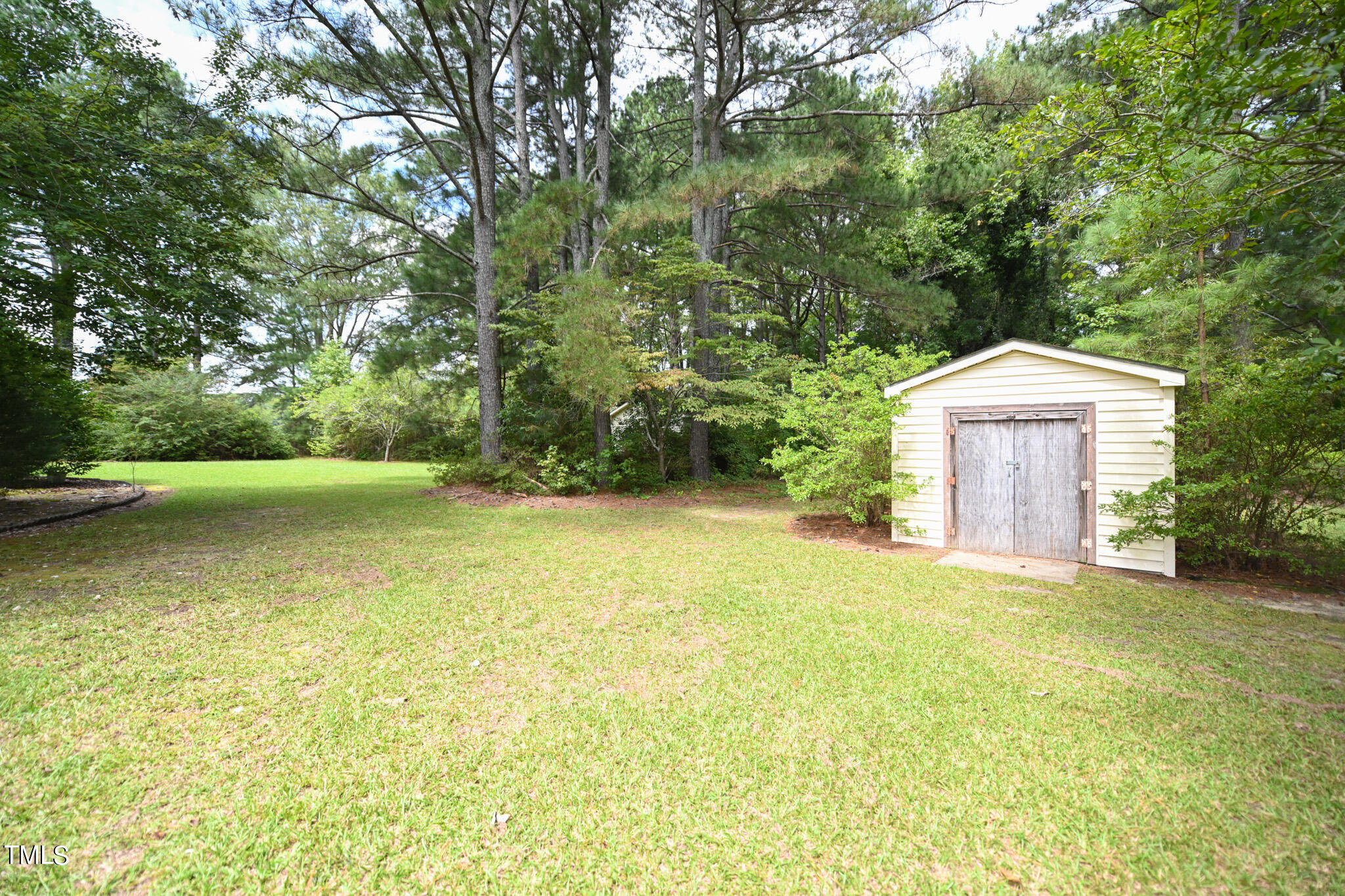 7254 Springfield School Road Lucama, NC 27851 - Photo 50 of 54 a view of a house with a yard and garage