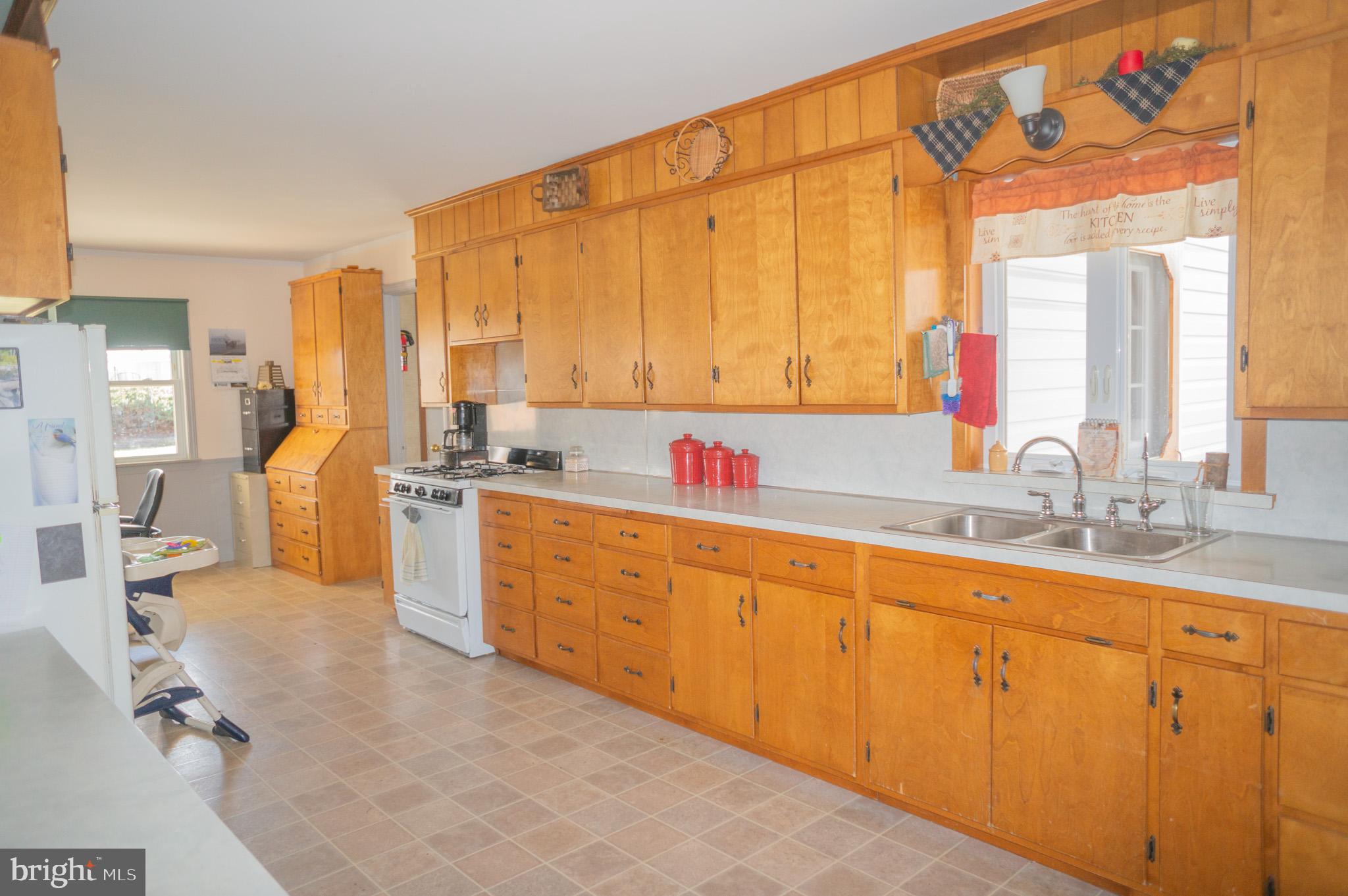 788 Buck Road New Providence, PA 17560 - Photo 19 of 70 a kitchen with sink cabinets and living room view