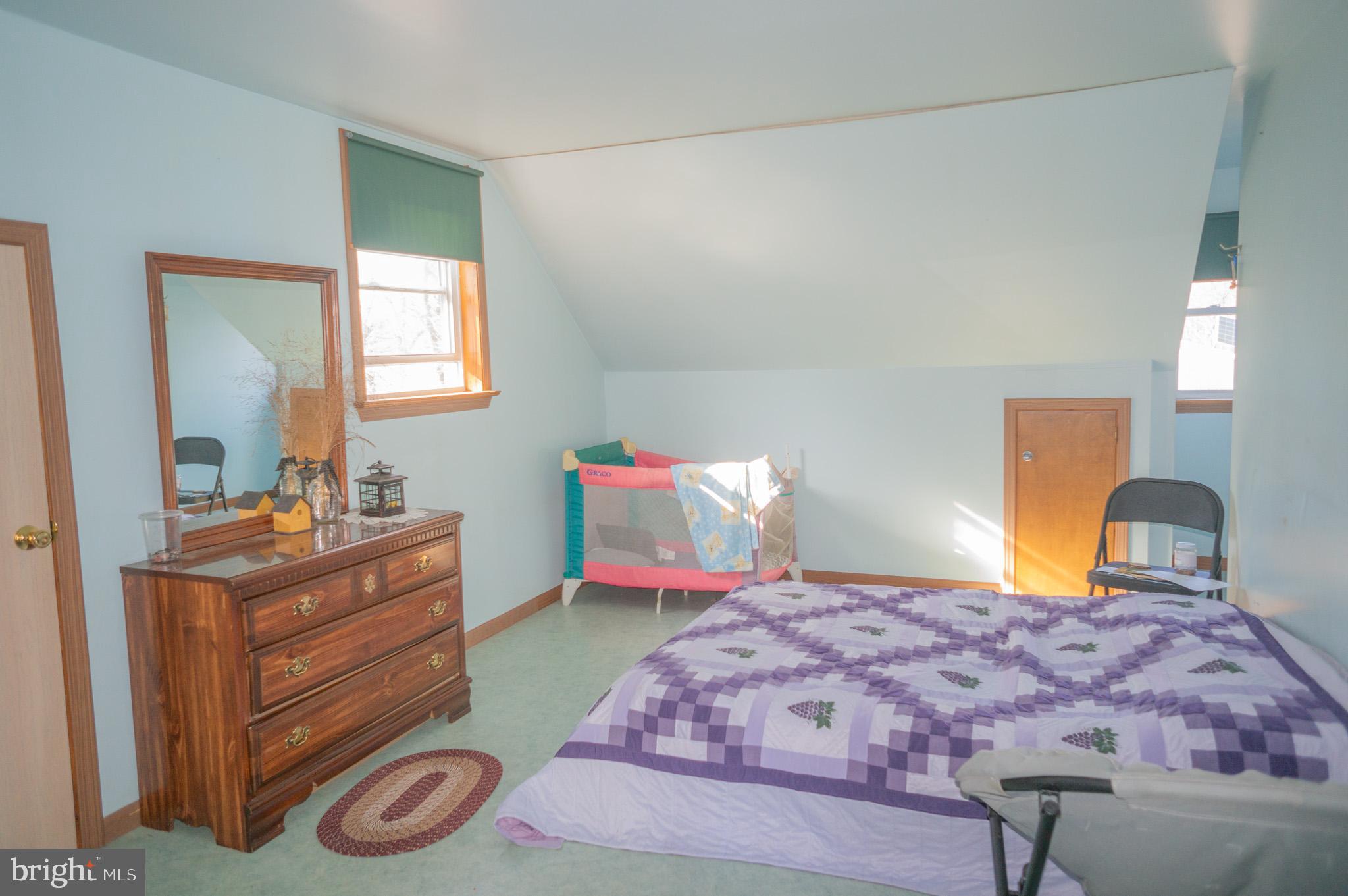 788 Buck Road New Providence, PA 17560 - Photo 27 of 70 a bedroom with a bed and a dresser in it