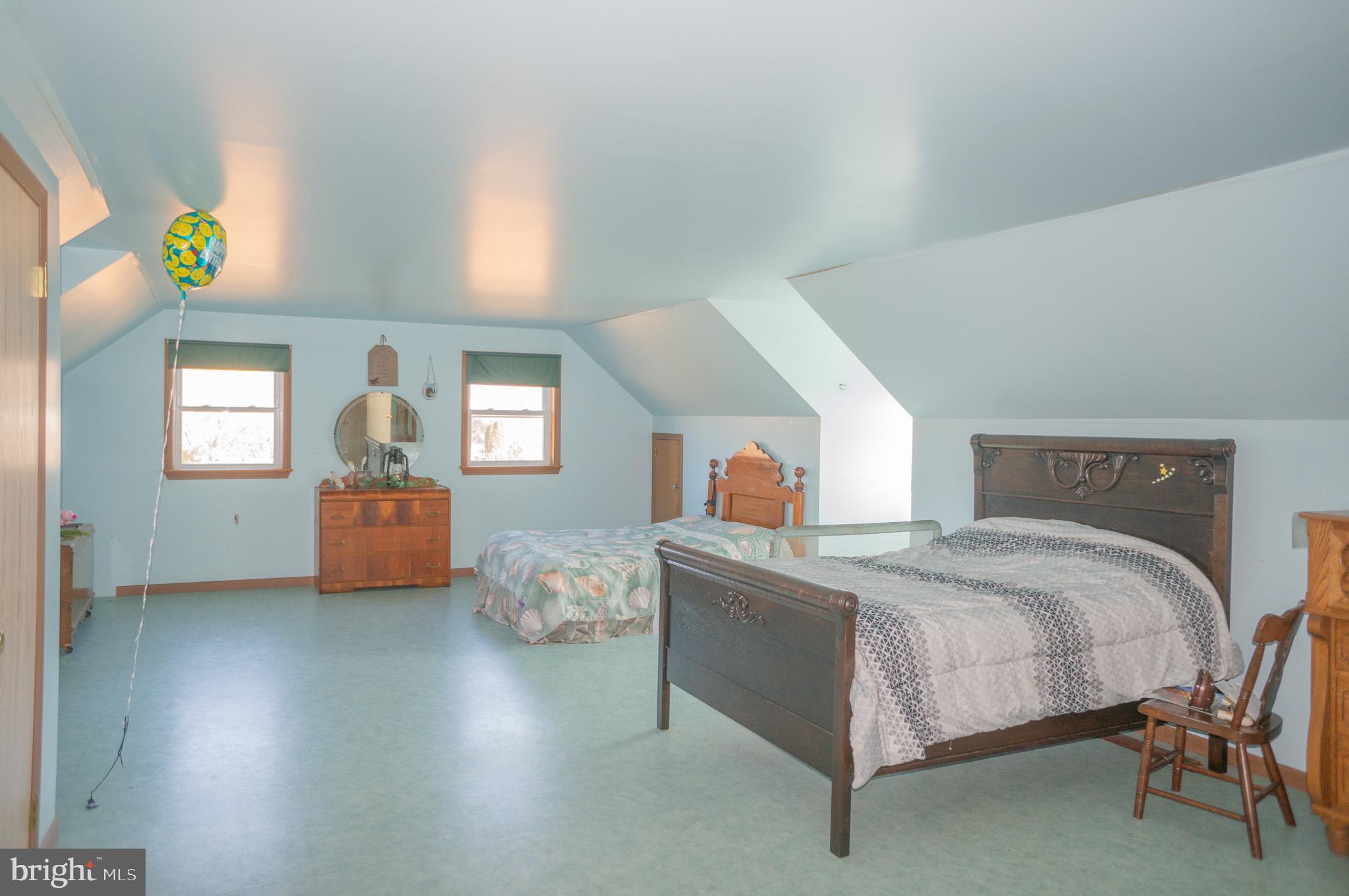 788 Buck Road New Providence, PA 17560 - Photo 29 of 70 a bedroom with a bed and a chandelier