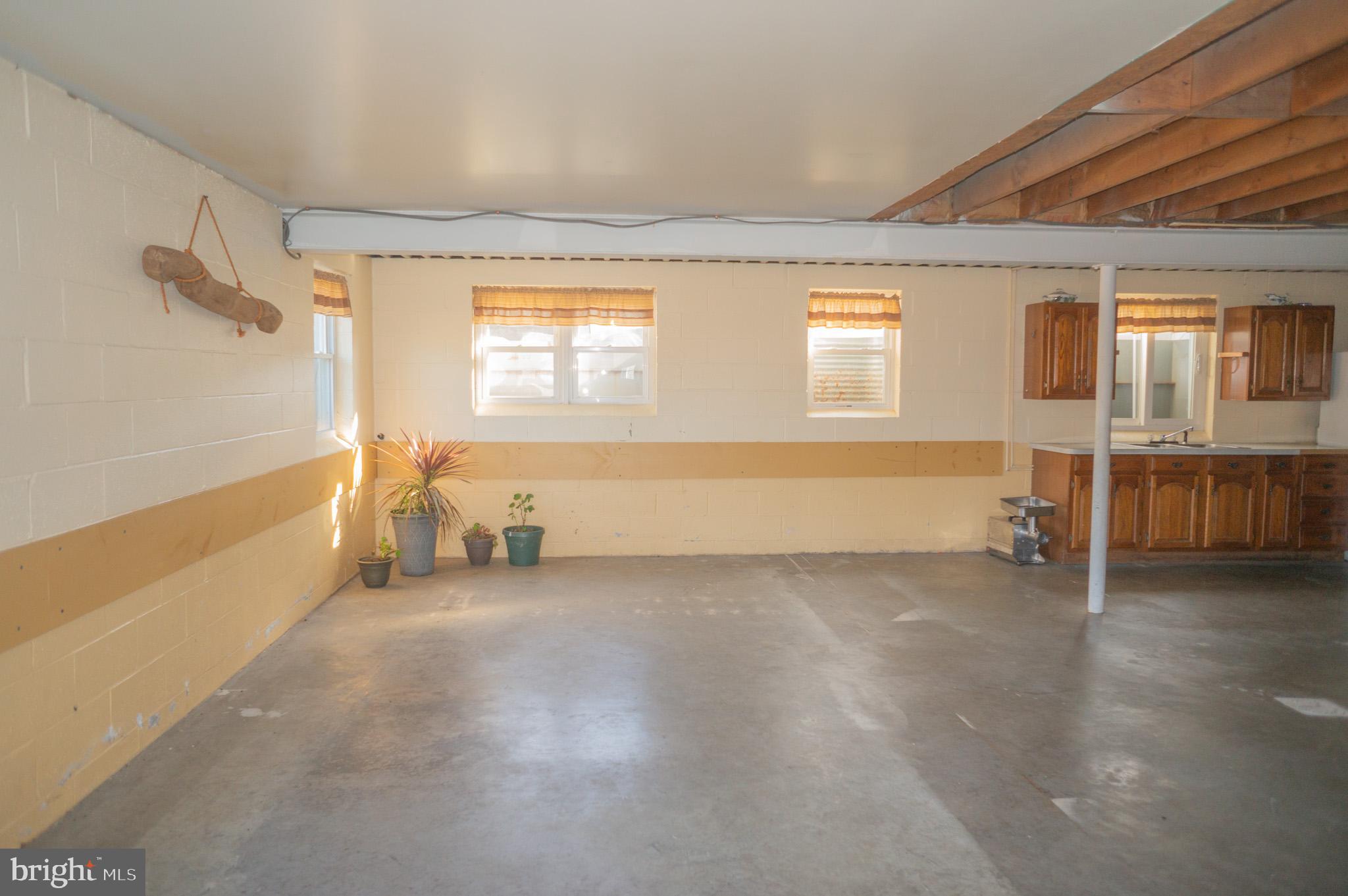 788 Buck Road New Providence, PA 17560 - Photo 36 of 70 an empty room with wooden floor and windows