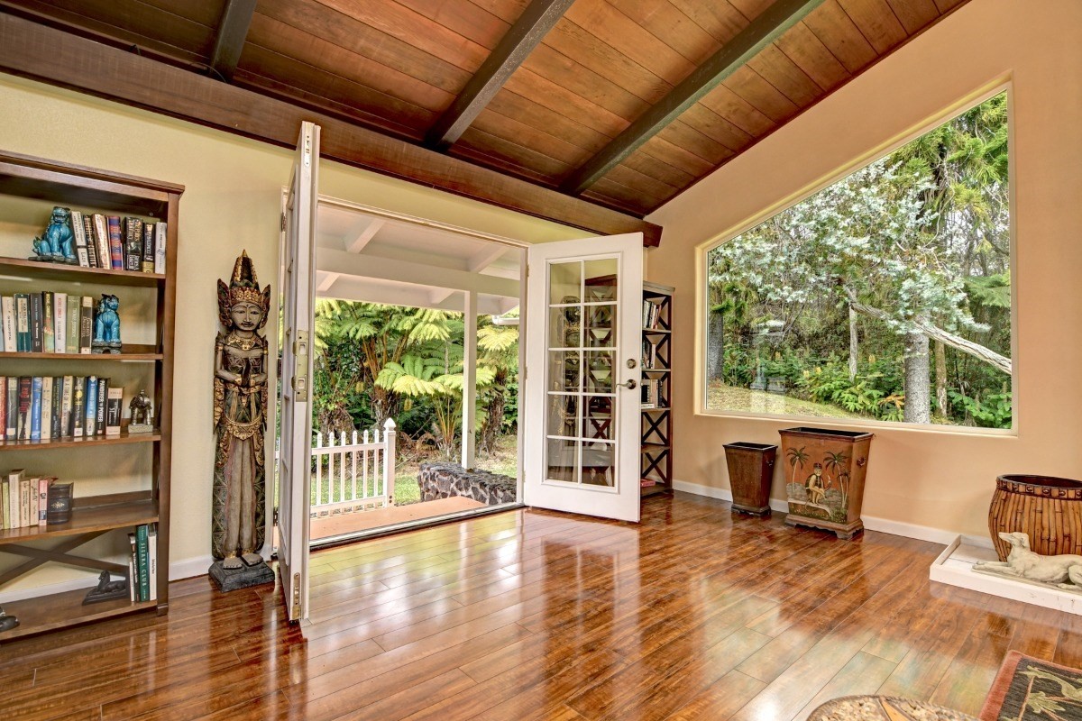19-4089 Wright Road Volcano, HI 96785 - Photo 16 of 30 a view of an empty room with wooden floor and a floor to ceiling window