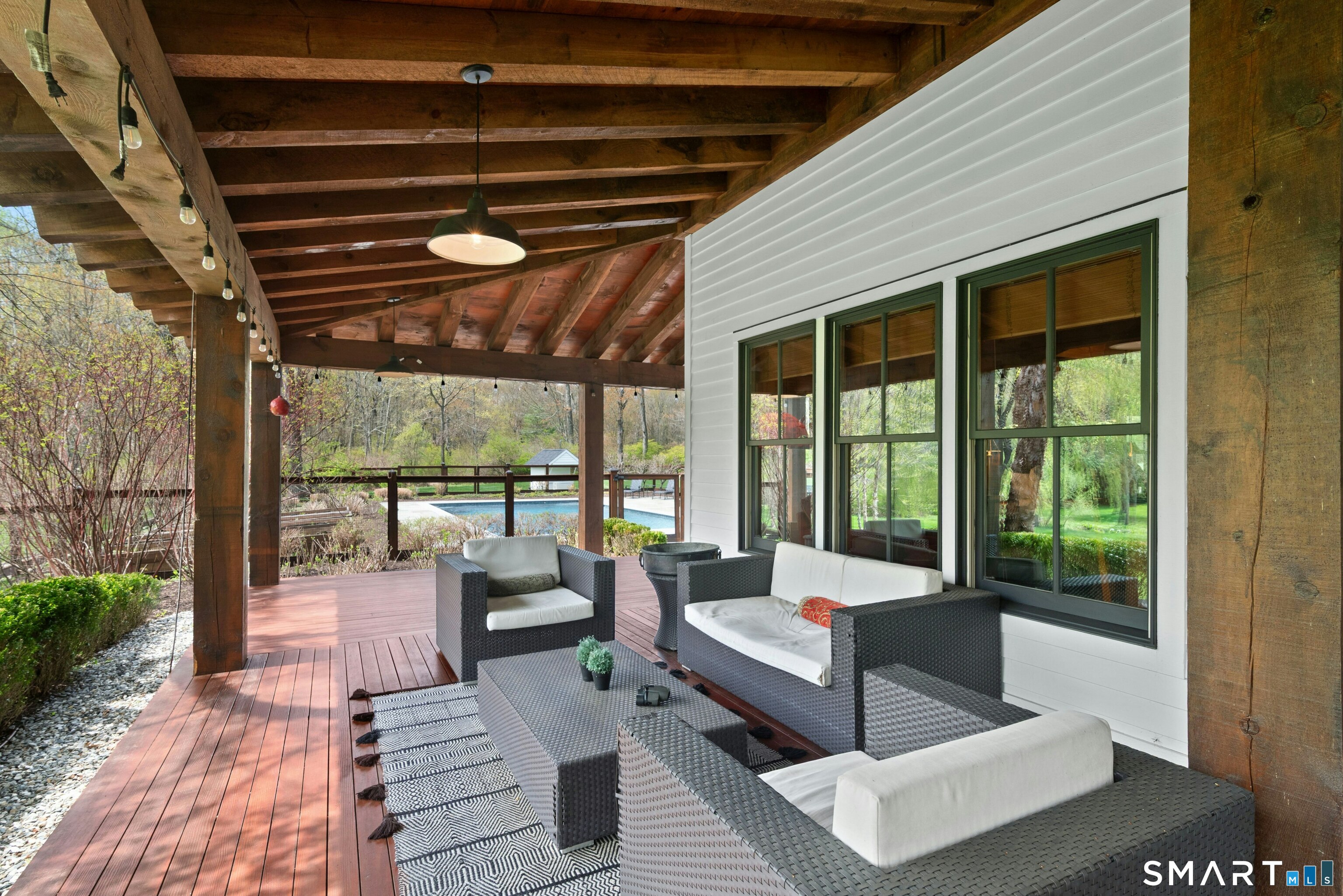 15 Silversmith Lane Redding, CT 06896 - Photo 27 of 36 Wrap-around deck, three sides, with pond, gardens, sweeping green lawn and pool views around.
