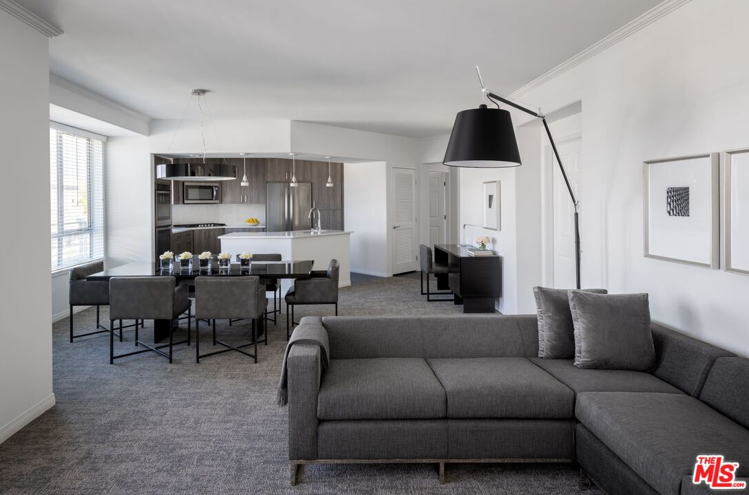 155 North Crescent Drive, Unit 1BRPR Beverly Hills, CA 90210 - Photo 4 of 10 a living room with furniture and a flat screen tv