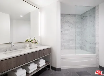 a bathroom with a bathtub and a sink