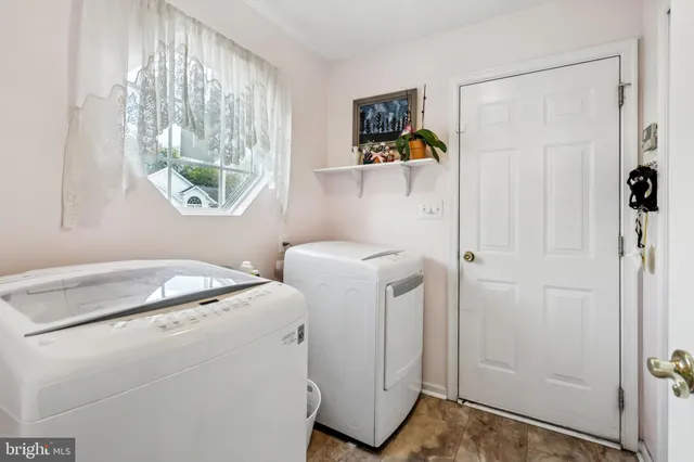 a utility room with dryer and washer