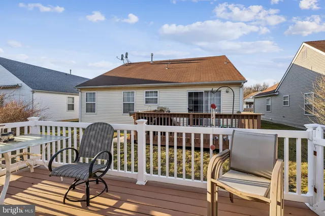 a view of a chair and table in the balcony