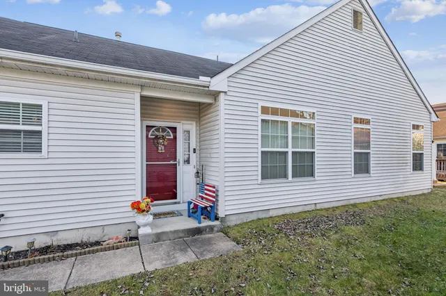a view of a house with small yard