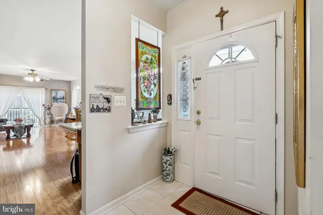 a view of an entryway with wooden floor