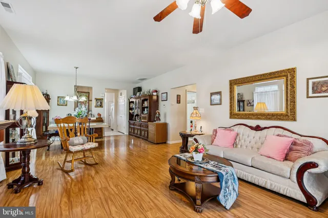 a living room with furniture or couch and a wooden floor