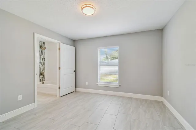 a view of an empty room and window