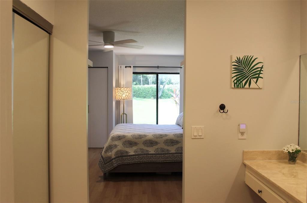 22383 Thousand Pines Lane Boca Raton, FL 33428 - Photo 14 of 28 a en suite bathroom with a sink and a window