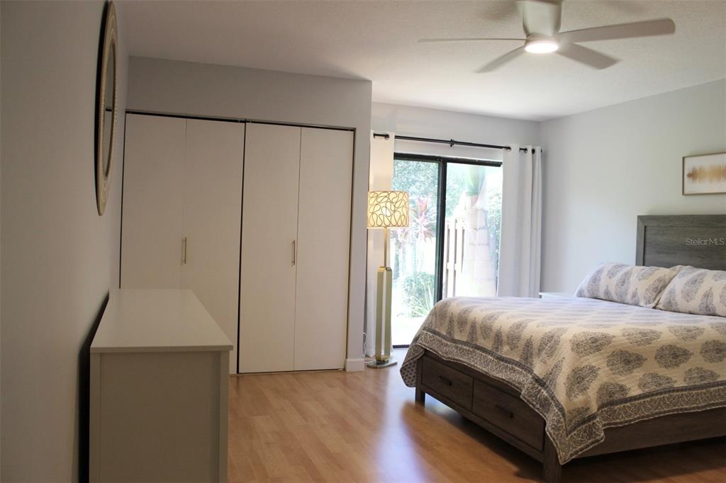 22383 Thousand Pines Lane Boca Raton, FL 33428 - Photo 14 of 29 a bedroom with a bed and a chandelier