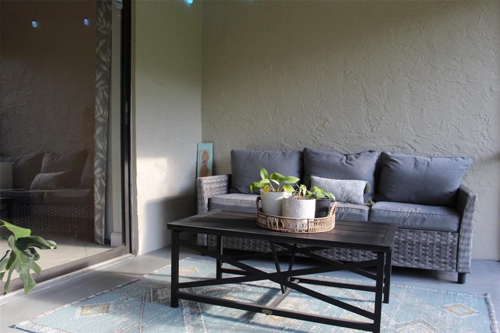 22383 Thousand Pines Lane Boca Raton, FL 33428 - Photo 22 of 29 a living room with furniture and a potted plant