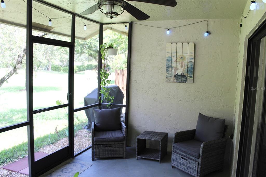 22383 Thousand Pines Lane Boca Raton, FL 33428 - Photo 22 of 28 a living room with furniture and a floor to ceiling window