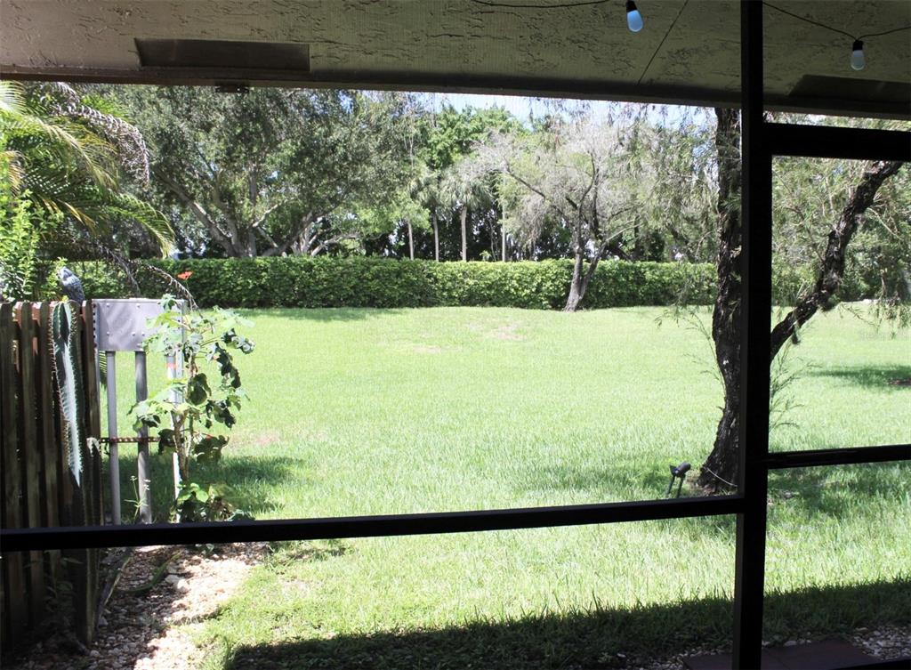 22383 Thousand Pines Lane Boca Raton, FL 33428 - Photo 24 of 29 a view of a yard from a balcony