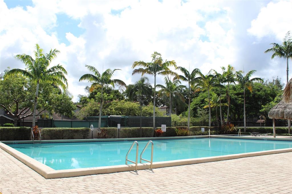 22383 Thousand Pines Lane Boca Raton, FL 33428 - Photo 27 of 29 a view of a swimming pool with a yard