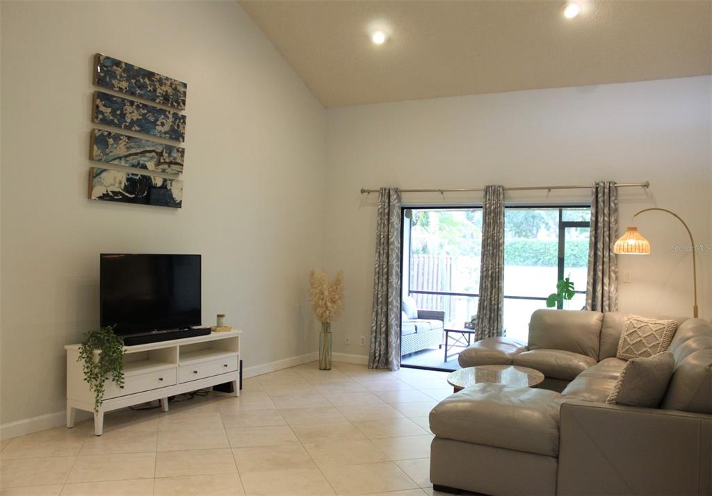 22383 Thousand Pines Lane Boca Raton, FL 33428 - Photo 6 of 28 a living room with furniture and a flat screen tv