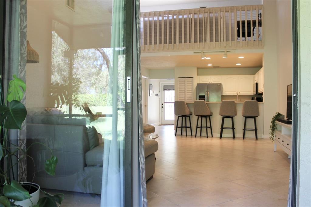 22383 Thousand Pines Lane Boca Raton, FL 33428 - Photo 8 of 29 a dining room with furniture and a floor to ceiling window