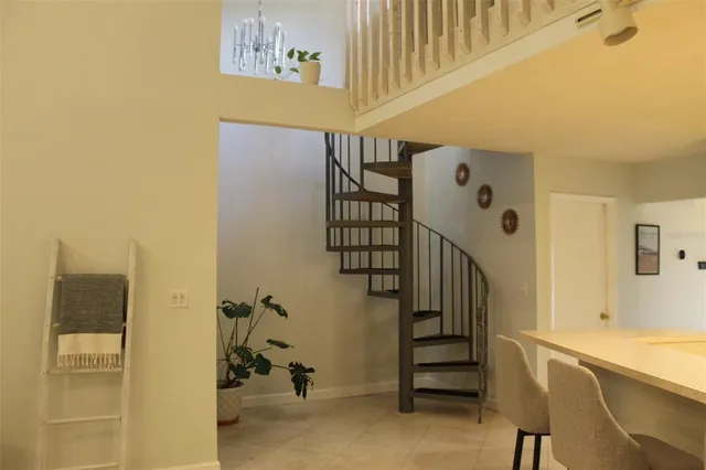 a view of staircase with white walls