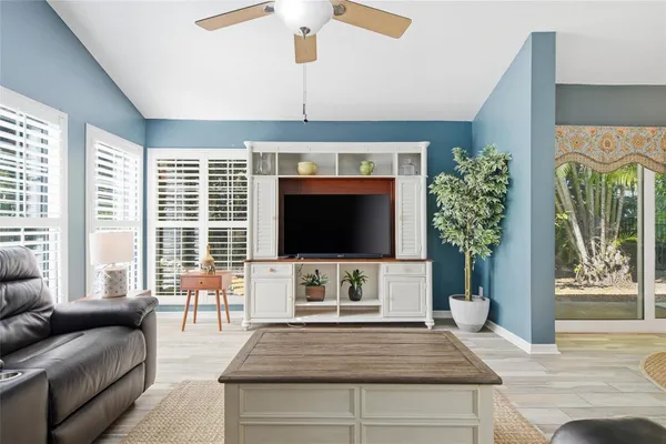 a spacious bathroom with a granite countertop sink mirror and vanity