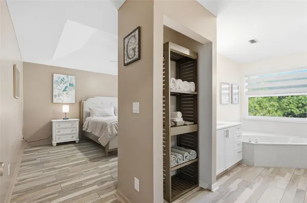 a bedroom with a bed and window