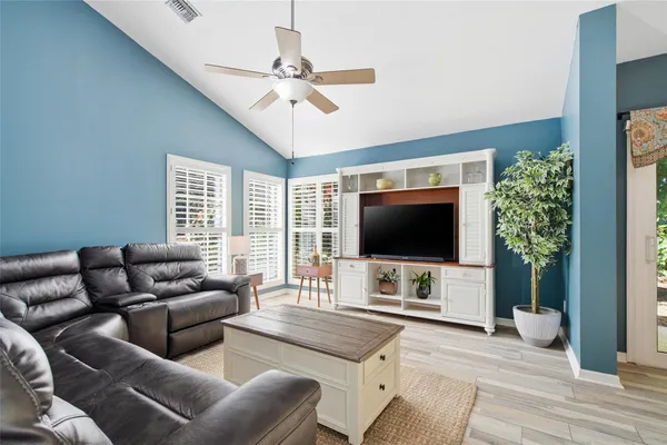 a living room with furniture and a flat screen tv