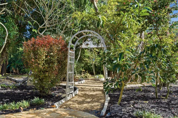 a view of a backyard with sitting area