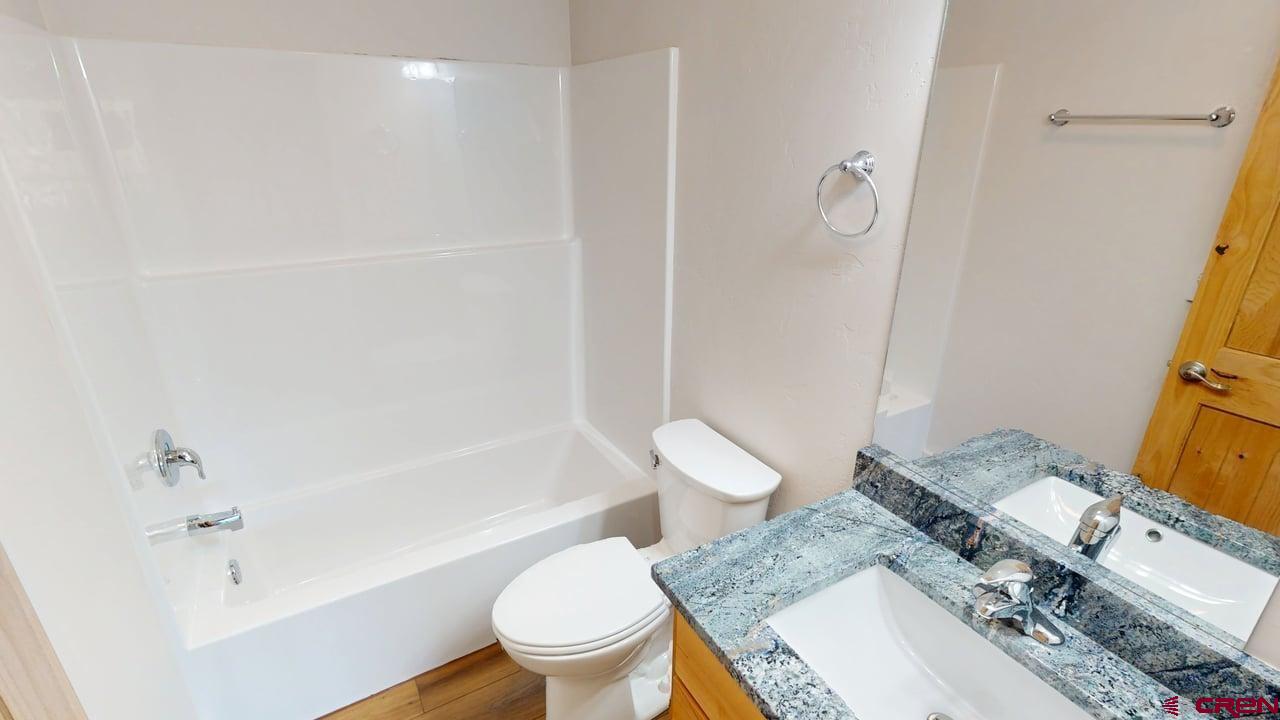216 Baca Grant Way Crestone, CO 81131 - Photo 10 of 17 a bathroom with a sink toilet and shower
