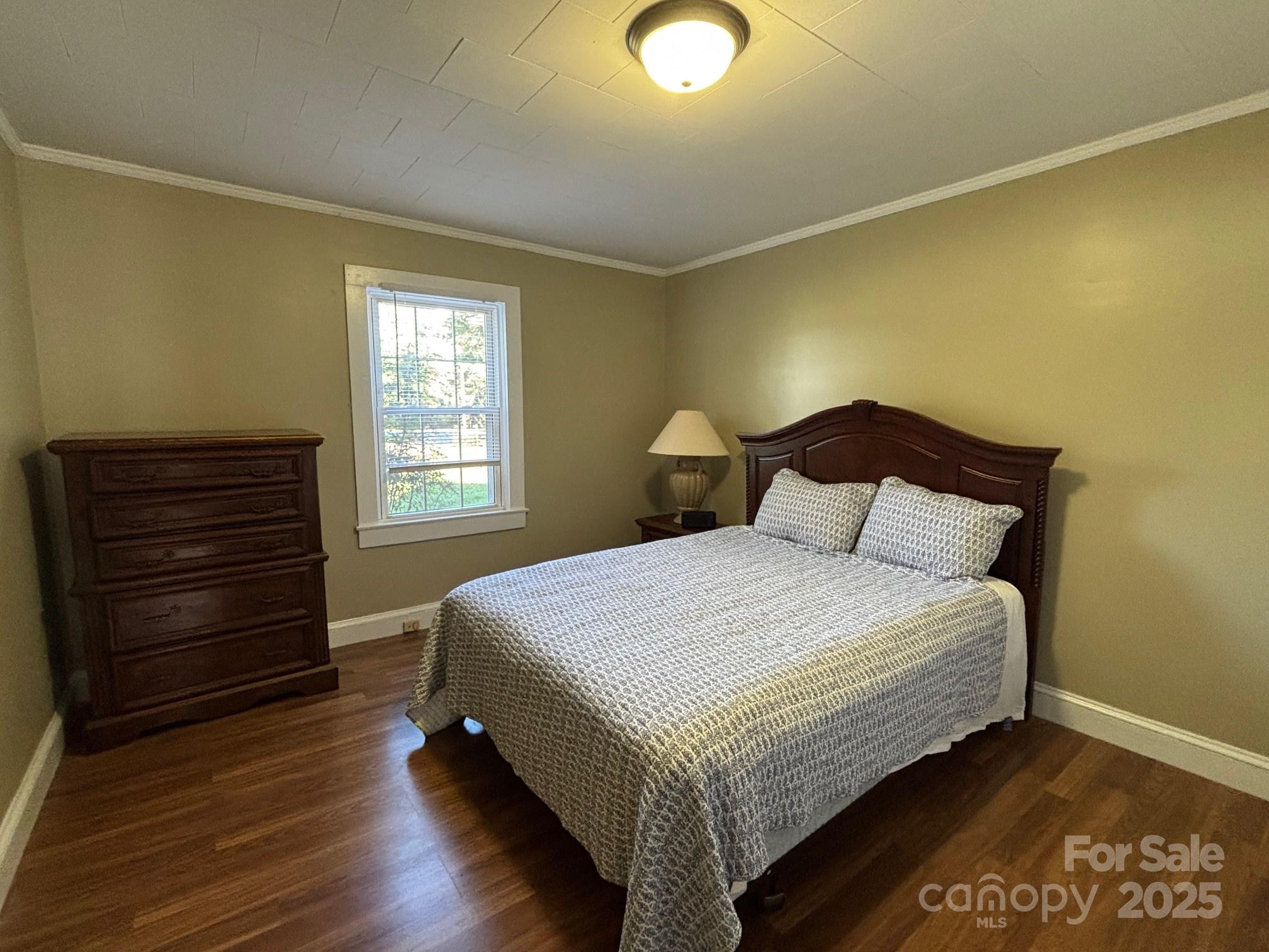 407 State Park Road Troutman, NC 28166 - Photo 14 of 21 a bedroom with a bed and window