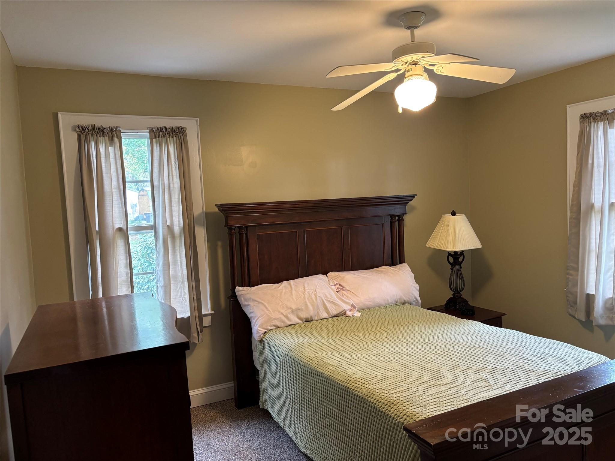 407 State Park Road Troutman, NC 28166 - Photo 15 of 21 a bedroom with a bed and a window