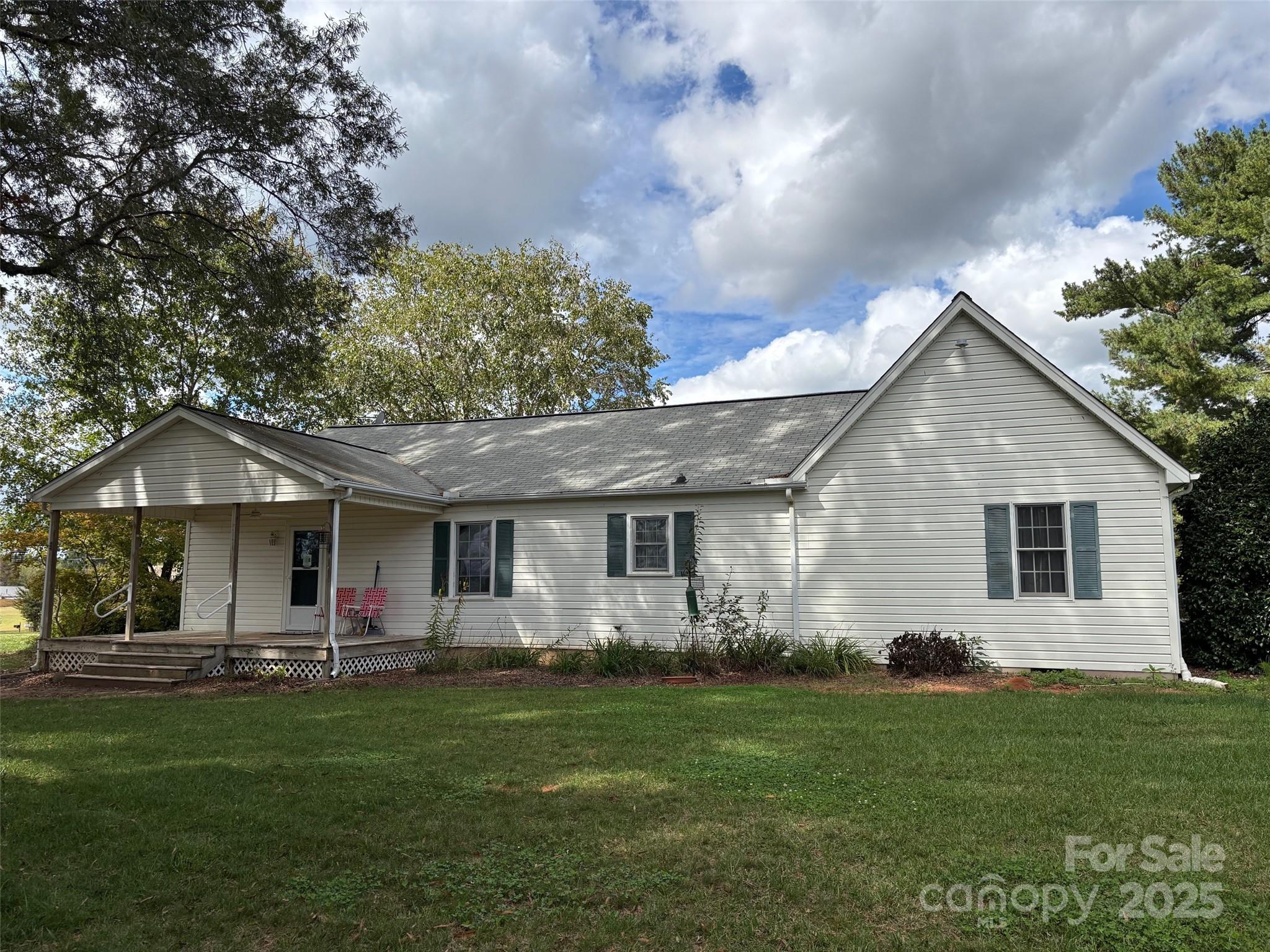 407 State Park Road Troutman, NC 28166 - Photo 3 of 21 a front view of house with yard and green space