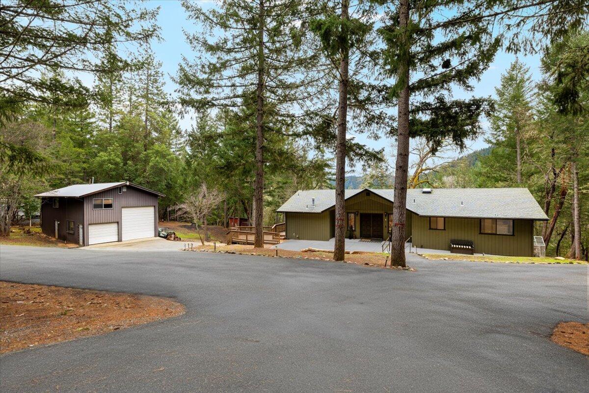 350 Splendor Drive Wilderville, OR 97543 - Photo 5 of 57 a house with trees in the background