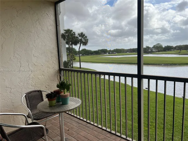 a view of a balcony with chair and table