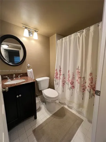 a bathroom with a toilet and a sink