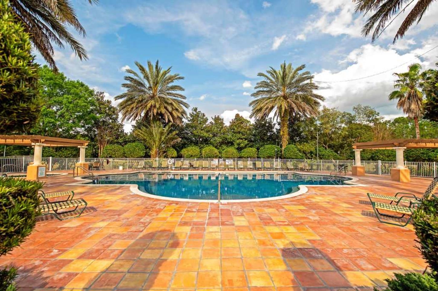 605 Fairway Drive, Unit 107 St. Augustine, FL 32084 - Photo 18 of 20 a view of a swimming pool with a patio and plants