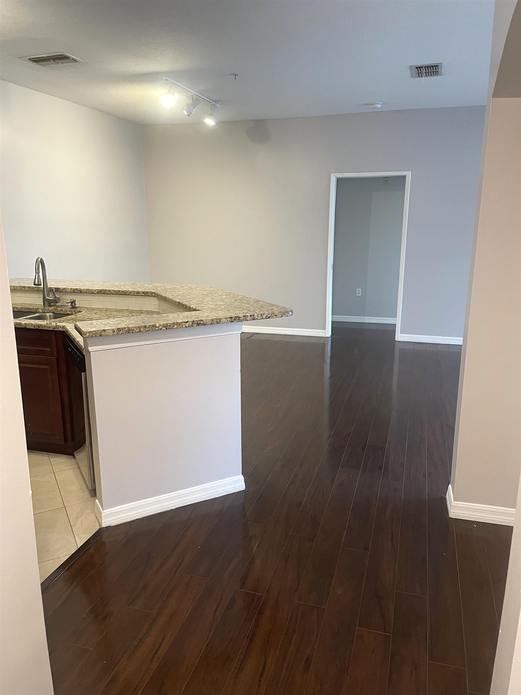 605 Fairway Drive, Unit 107 St. Augustine, FL 32084 - Photo 2 of 20 an empty room with wooden floor